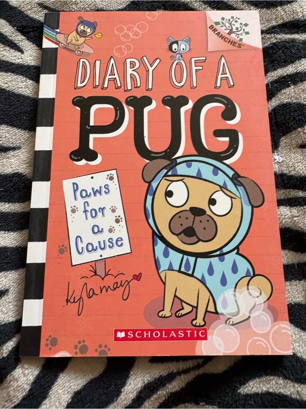 Scholastic Orange Pug Cover with Blue-Raindrop Hoodie